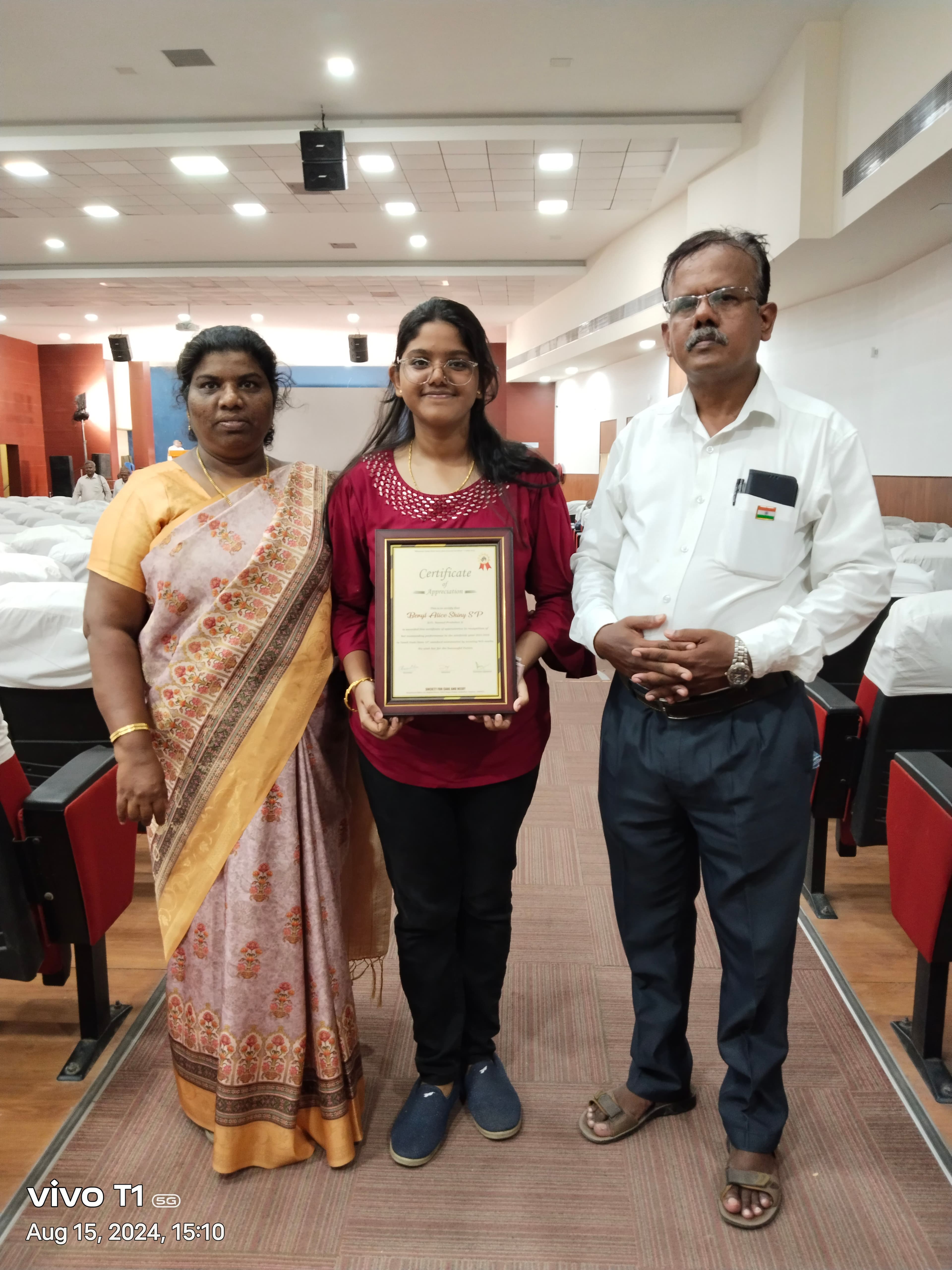 Award for missionary kids who scored above 90 girl